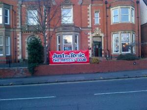 Just The Tonic banner outside the club during the Festival